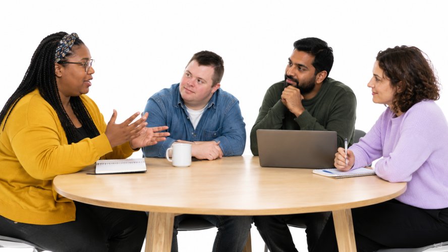 People at at table chatting