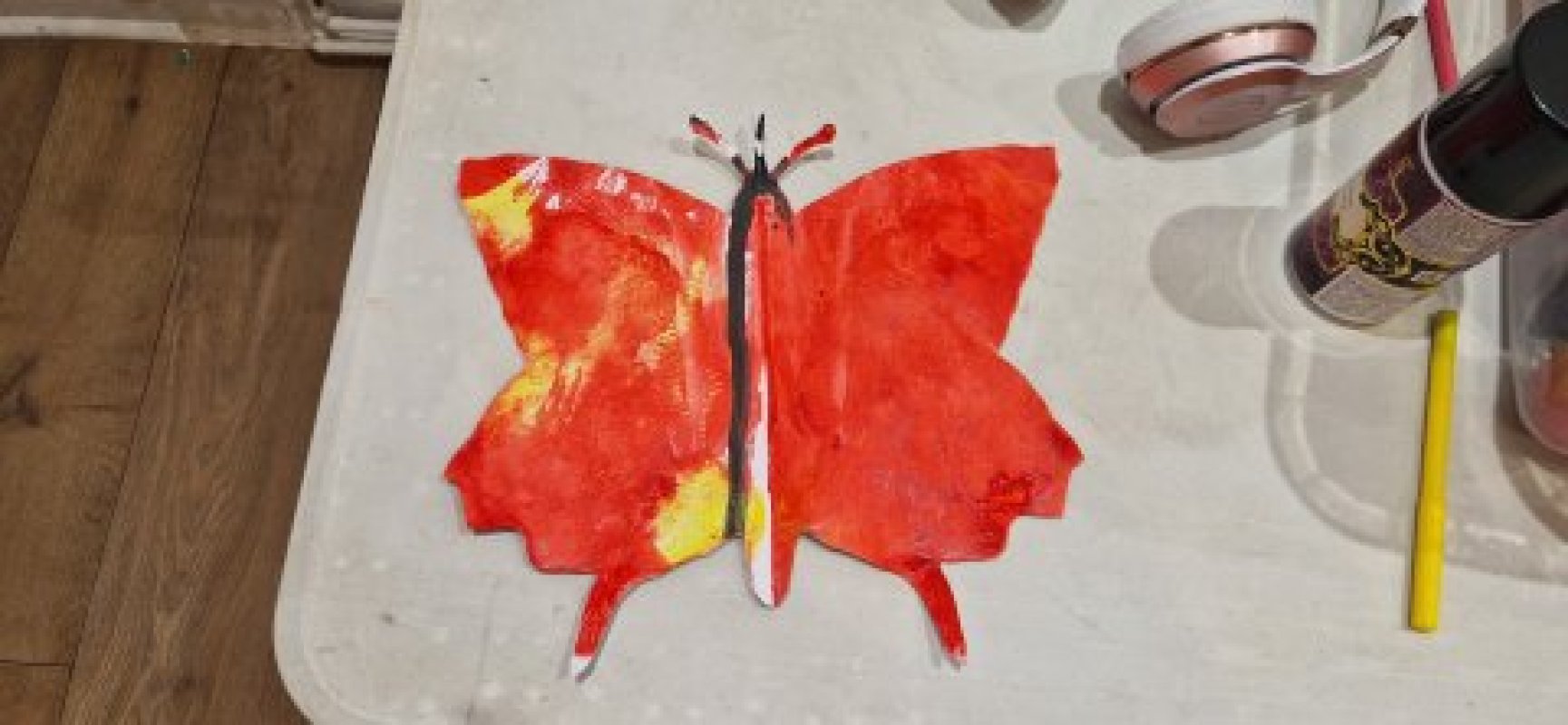 A painting of a butterfly in orange